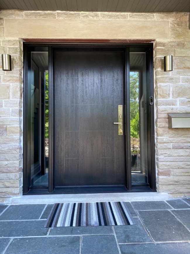 modern black entry door gives a home a new look