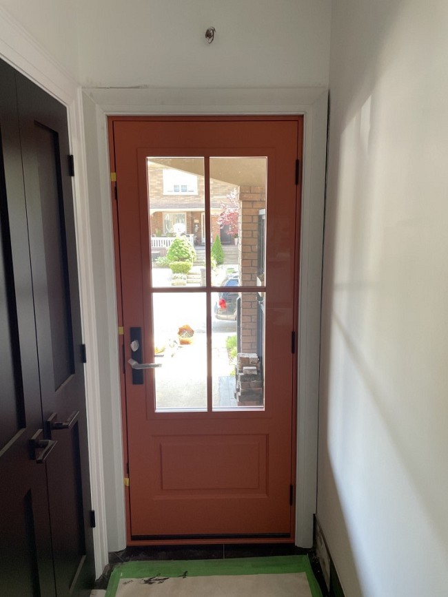 pastel red entry door