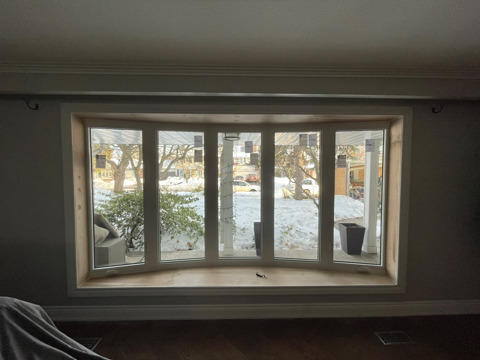 Interior view of a large bay window installation in progress during a Toronto winter, demonstrating year-round professional installation capabilities.