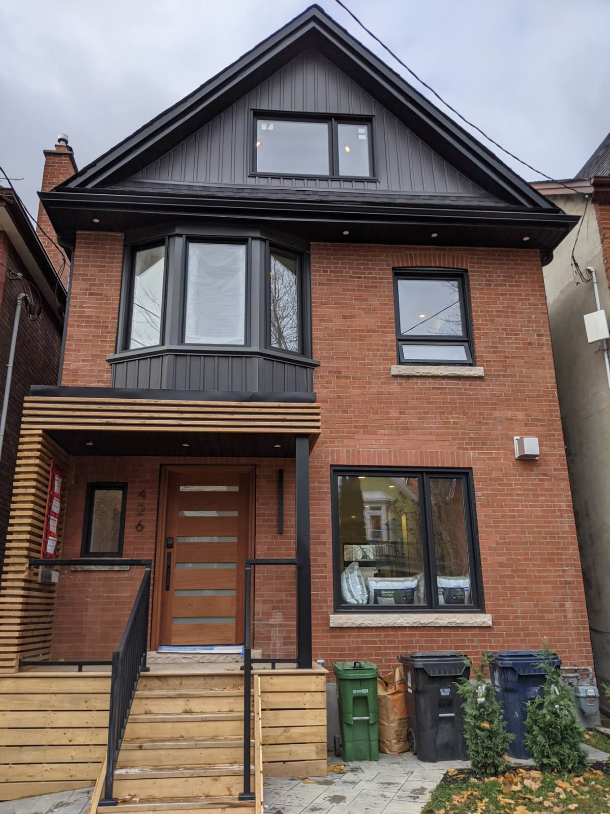 Red brick Toronto home with a custom bay window installation