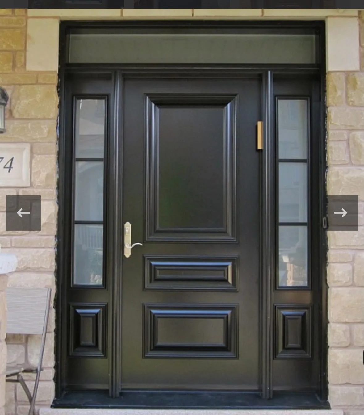 Black raised-panel entry door with glass sidelites and transom in a stone entrance, door manufacturer and supplier in Toronto