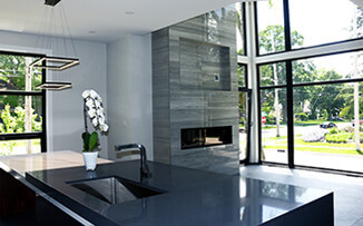 These floor-to-ceiling windows and doors give well-lit and open contemporary look to this home in Toronto Canada