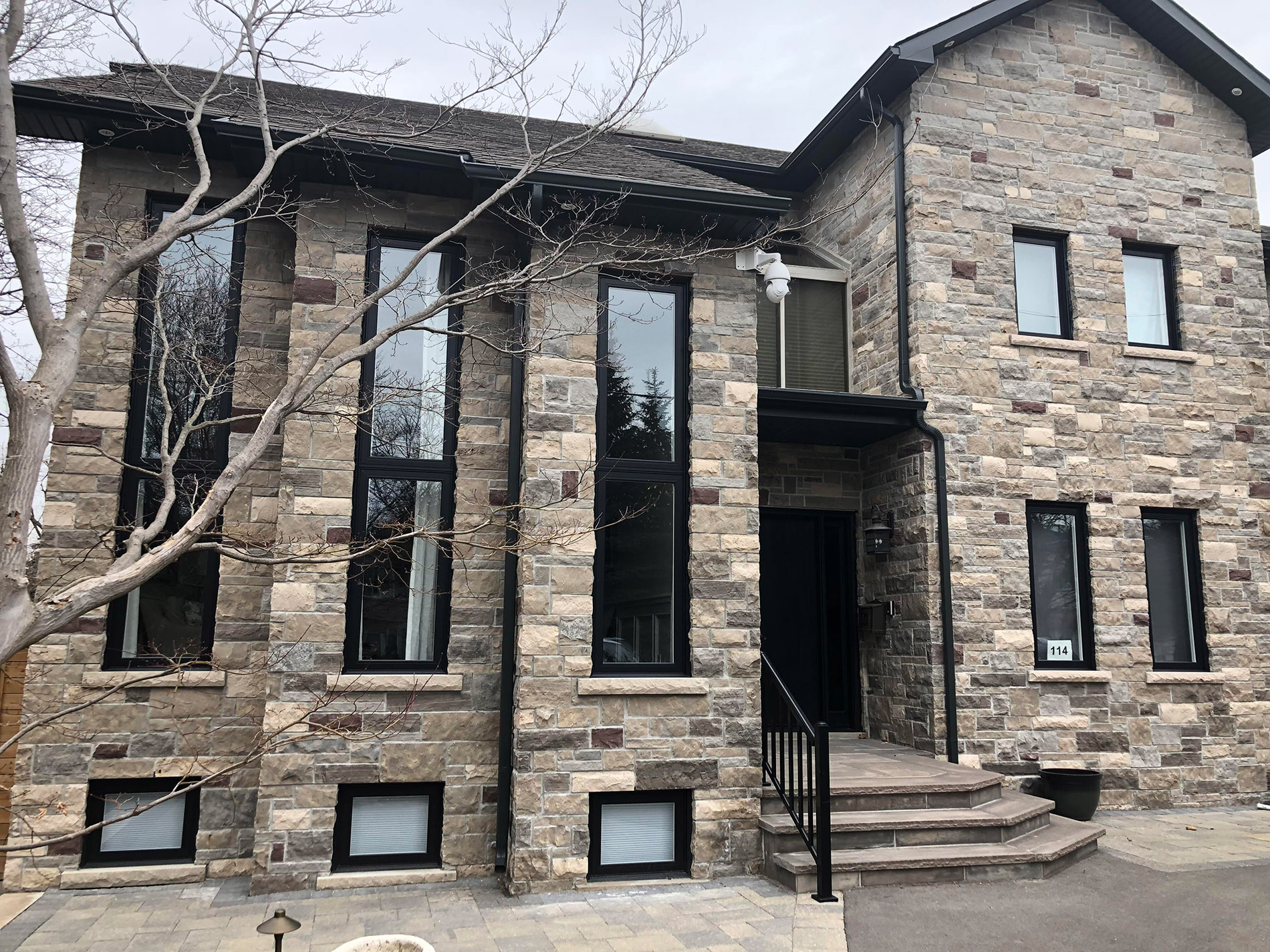 stone-house-modern-windows-canada